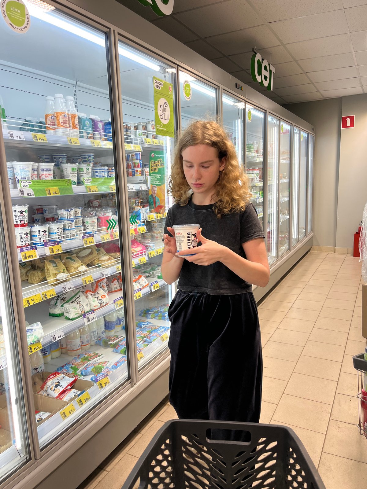 Woman shops for groceries at Vasilyevo supermarket