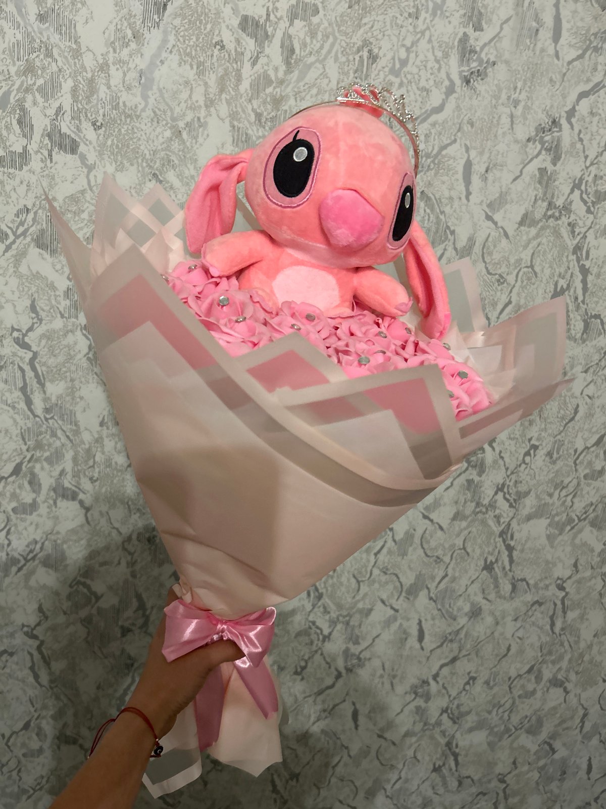 Pink Stitch bouquet and dog getting petted