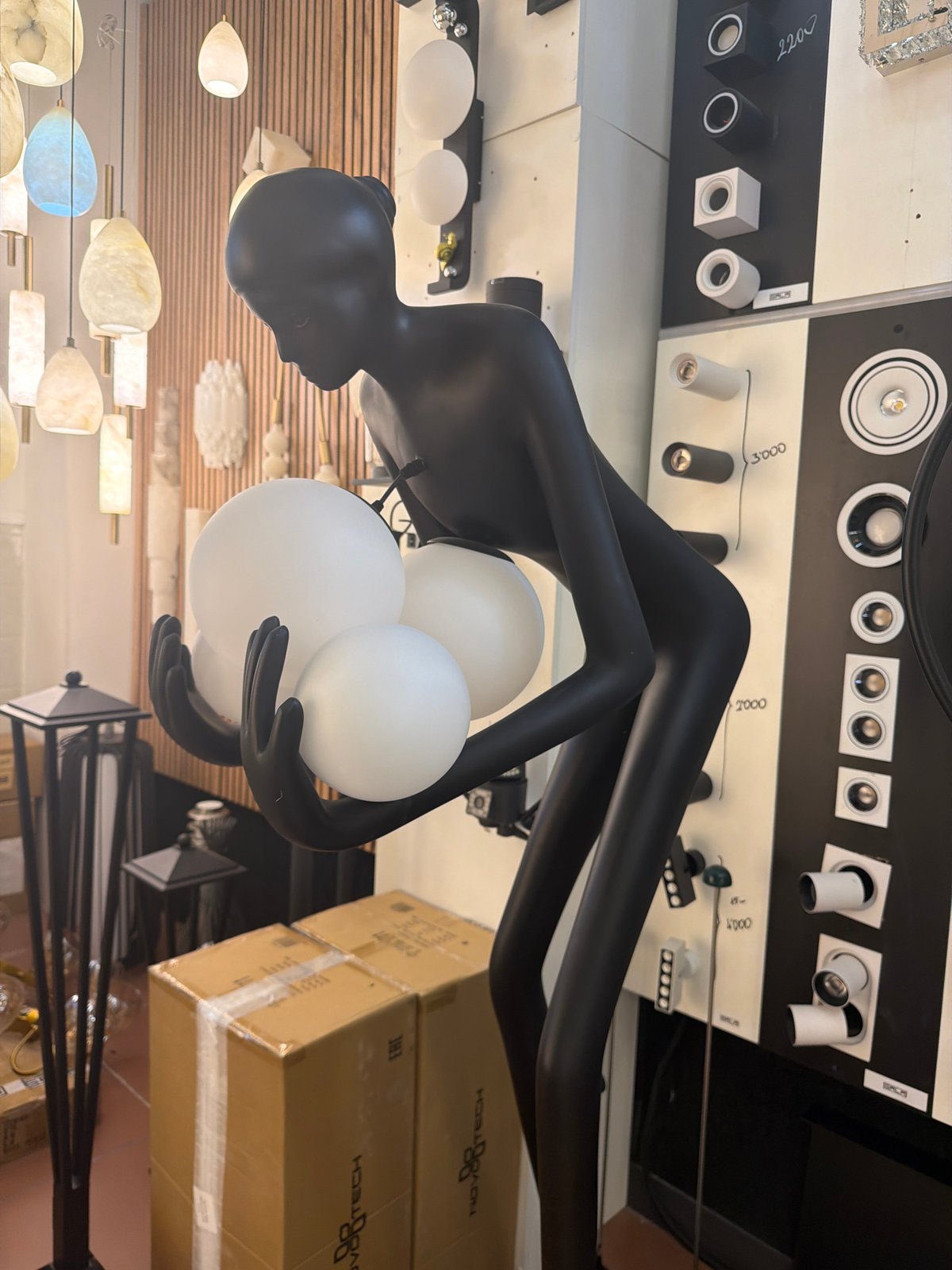 Moscow shopper explores upscale lighting store displays