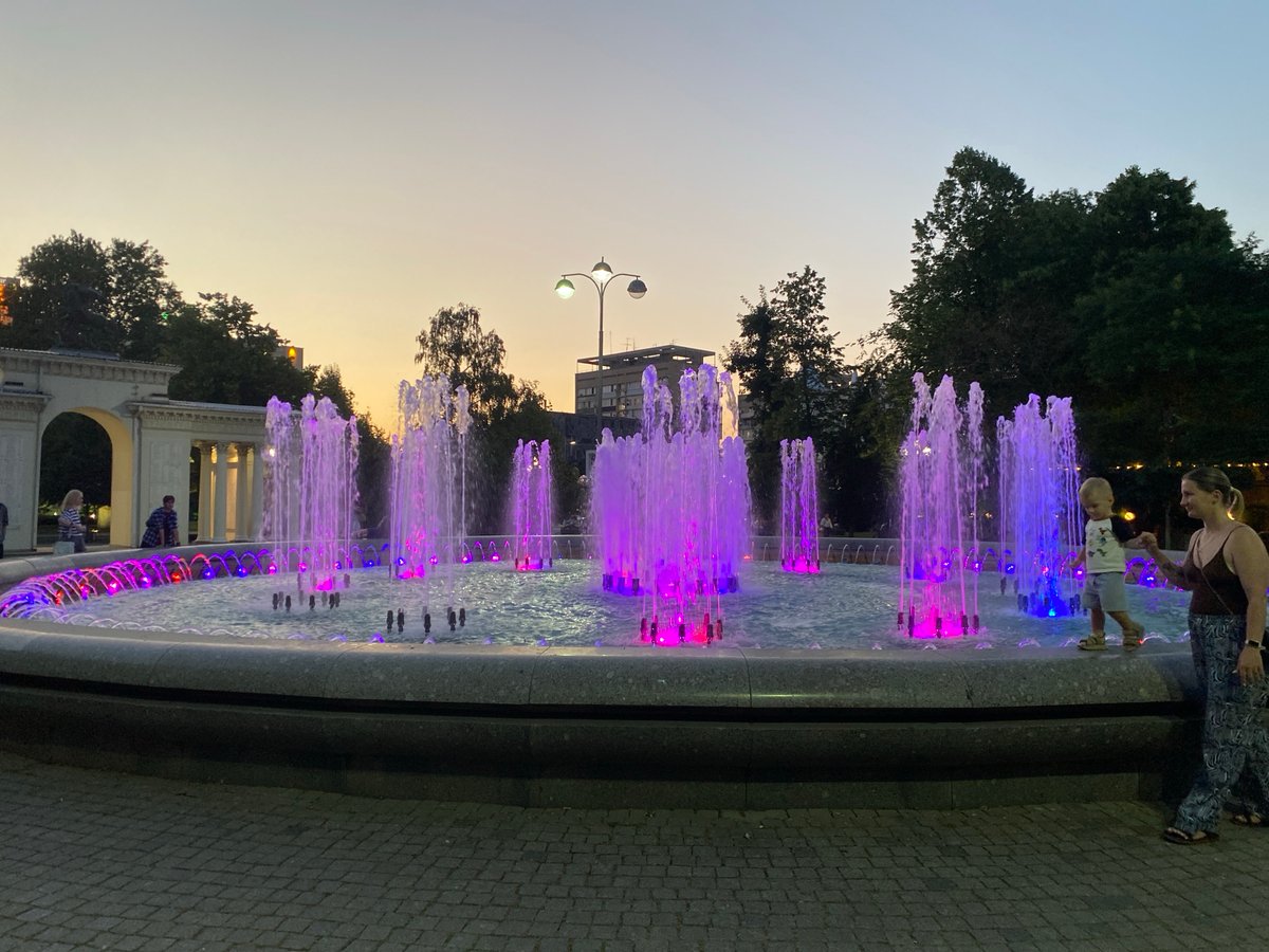 Krasnodar fountain glows pink and purple at dusk