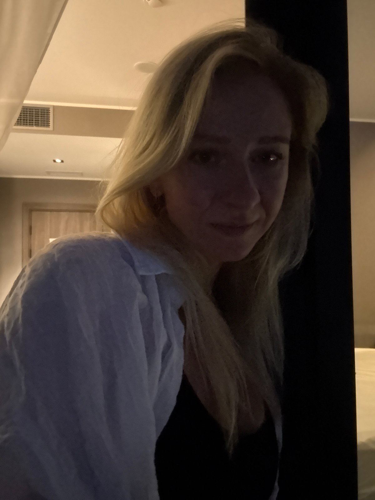 Quiet evening in a Kerch hotel room, city lights outside