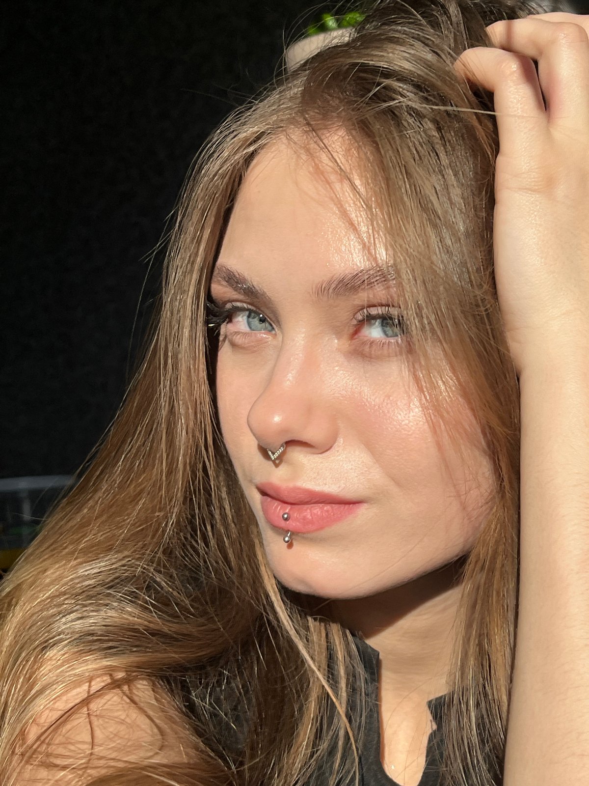 Young woman with piercings photographed in Russian village