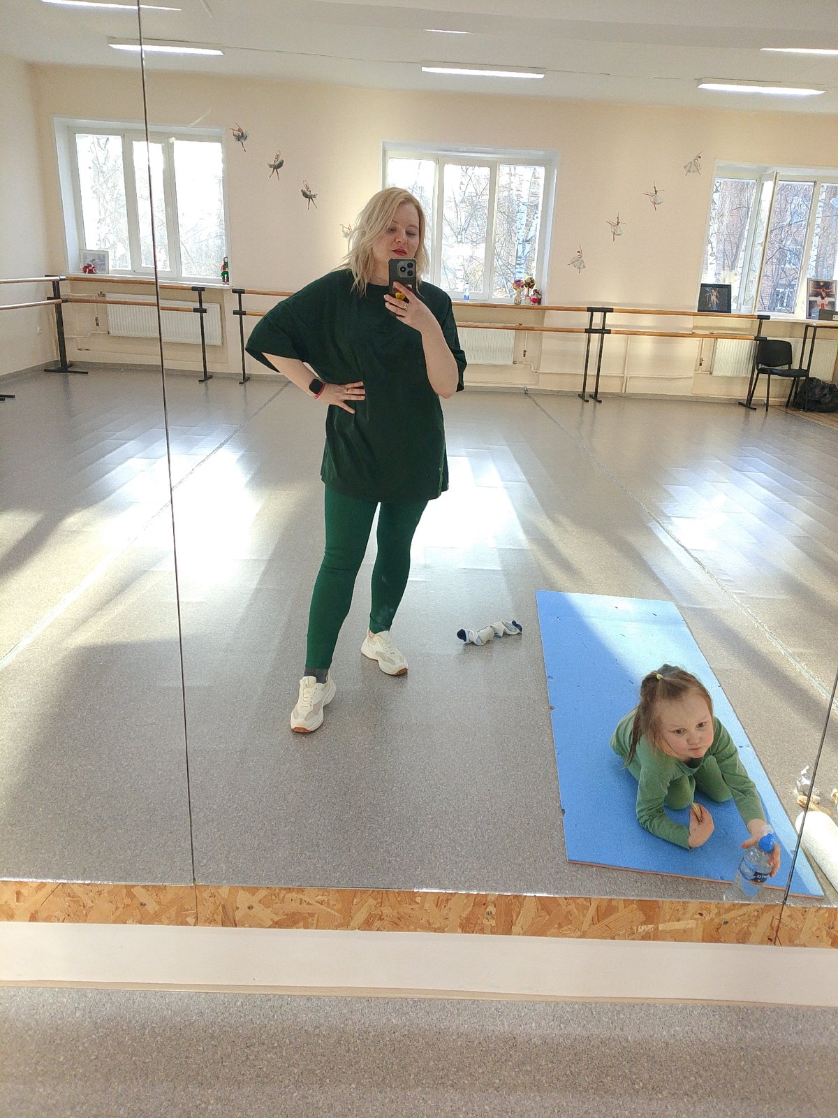Mirror selfie and handmade doll captured in Izhevsk