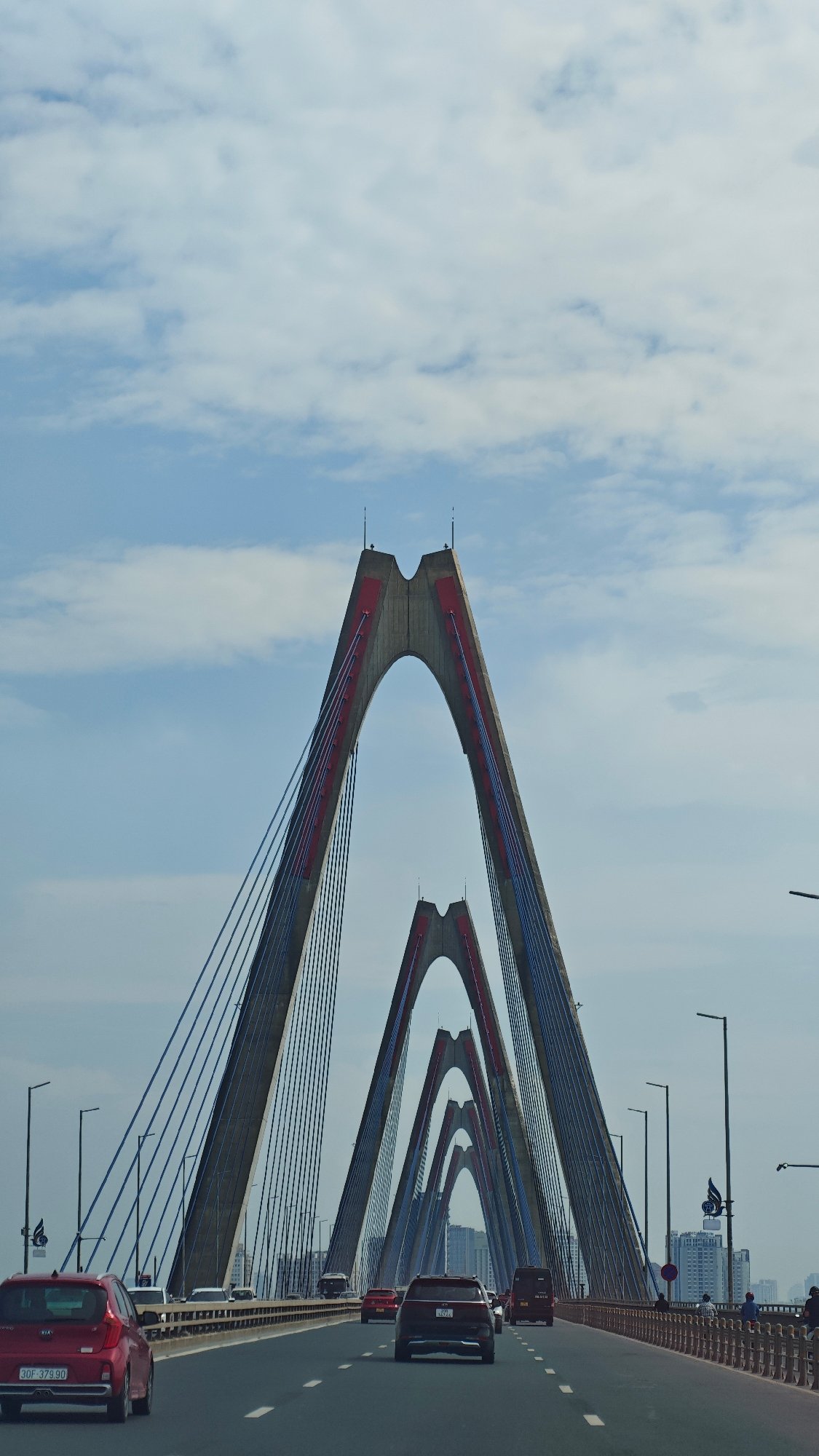 Morning taxi ride across Nhật Tân Bridge in Hanoi