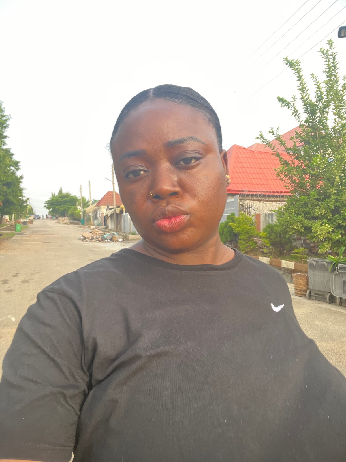 Morning routines unfold across Abuja residential neighborhoods