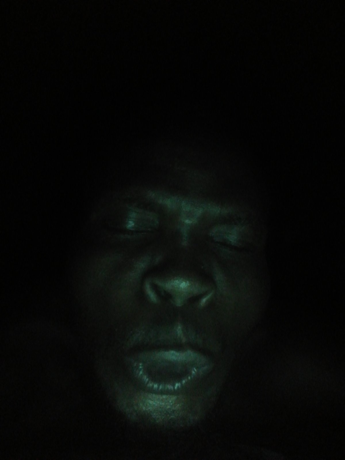 Multiple photos document man's varying expressions over evening hours