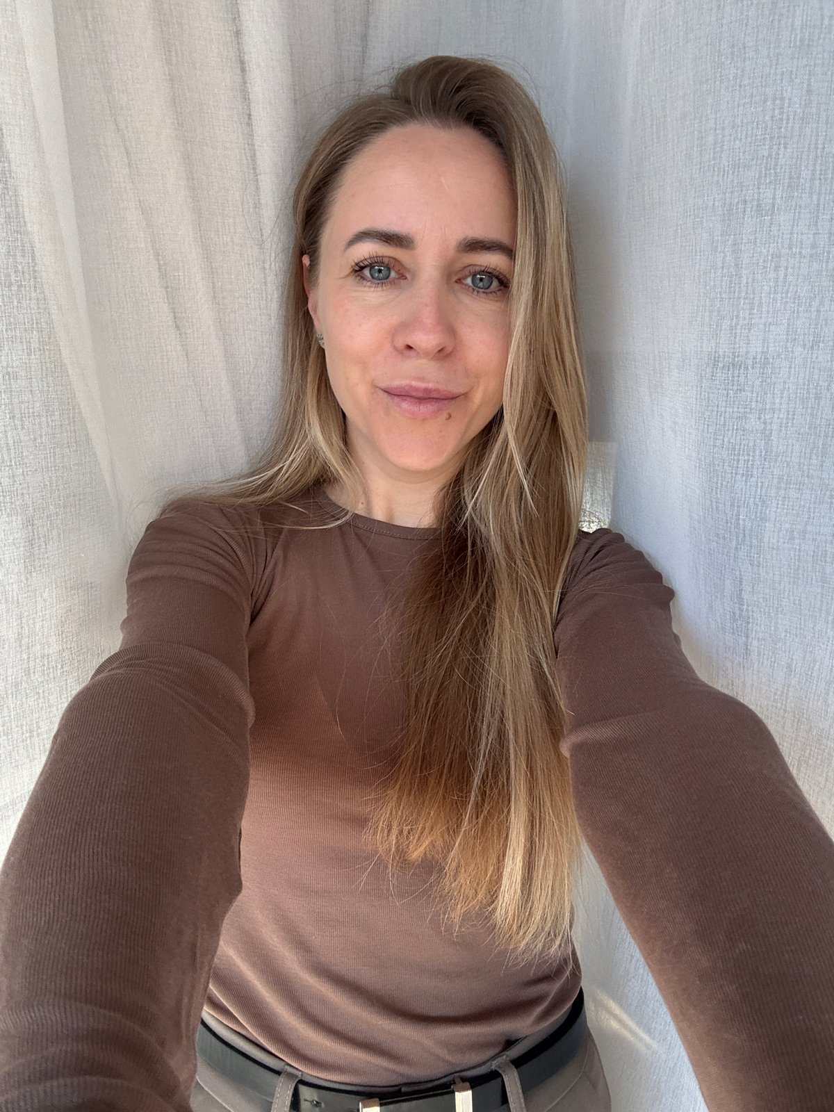 Woman takes selfies indoors in Chaikovsky, Russia