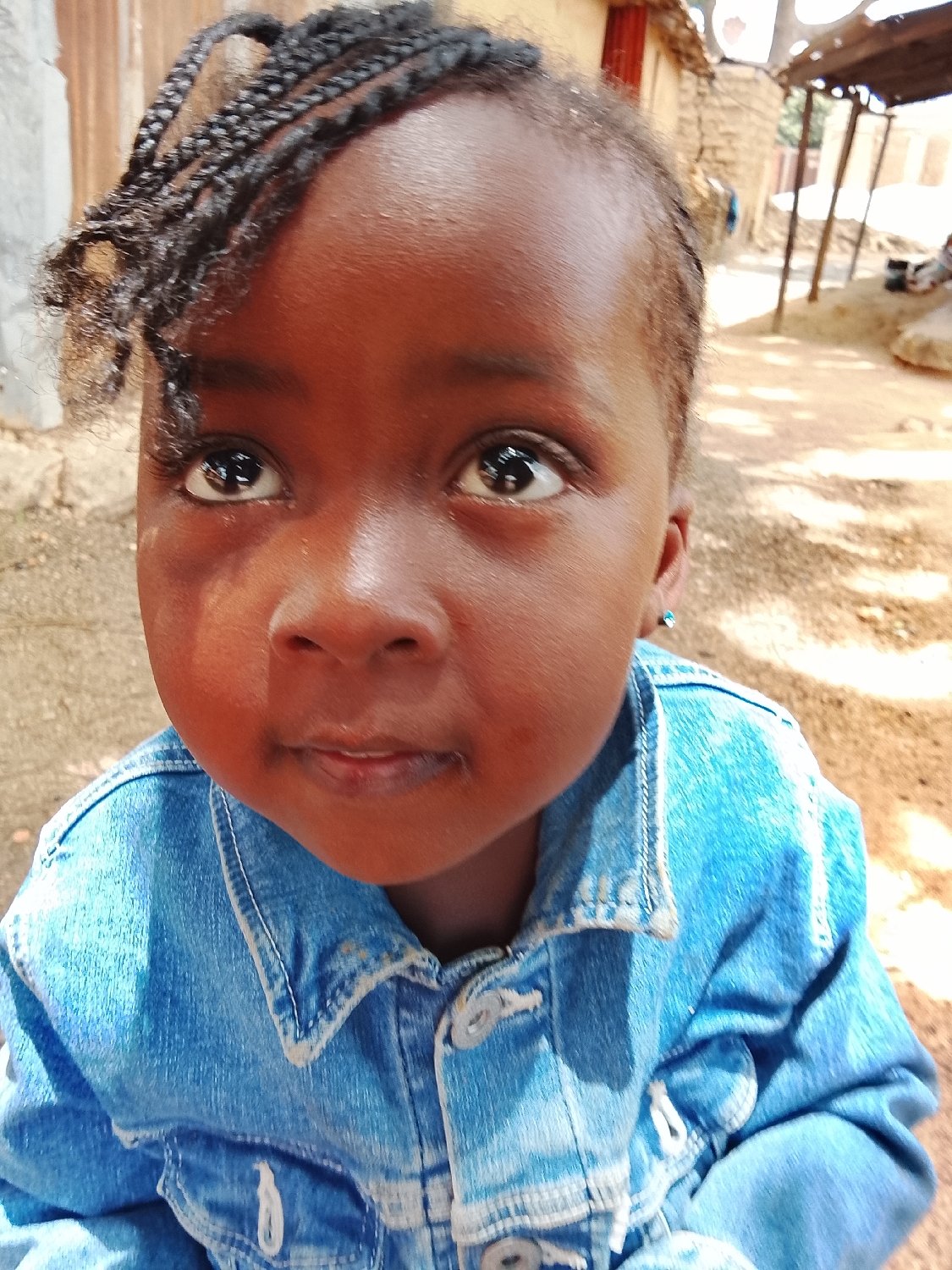 Child observed near outdoor metalworking workshop during daylight hours