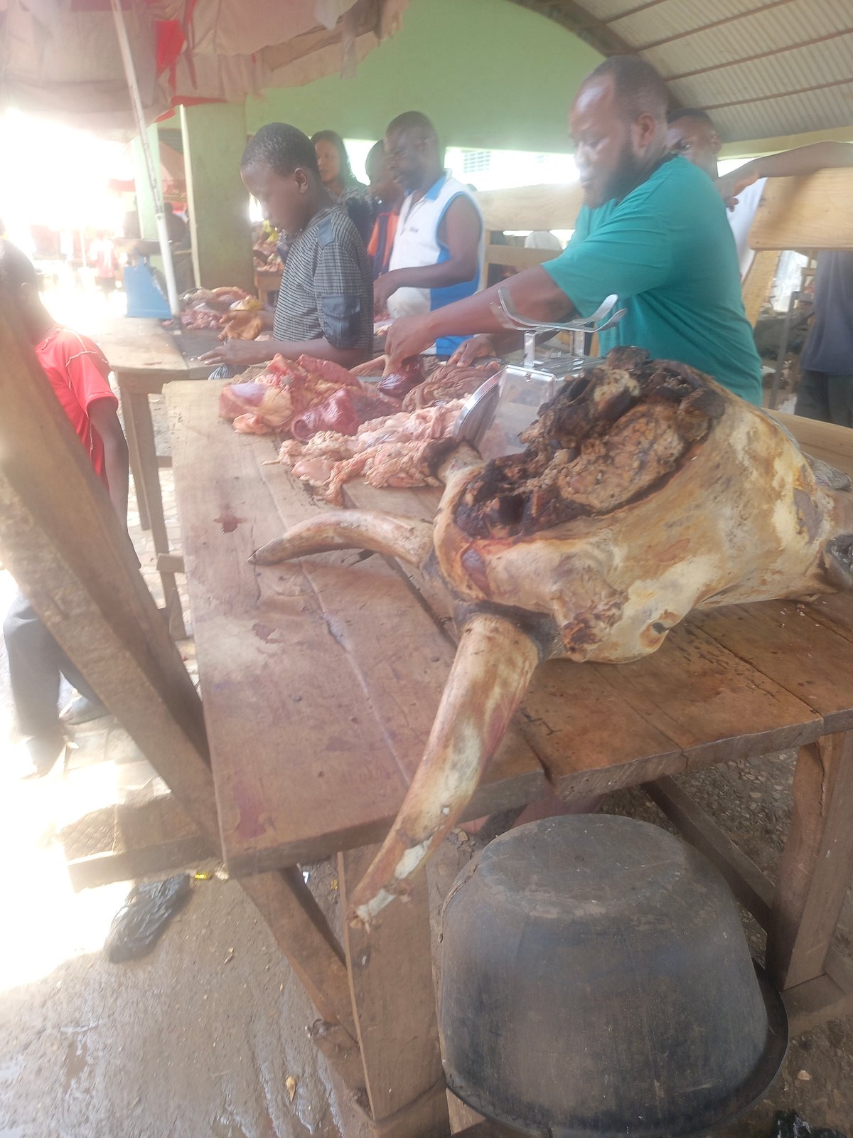 Butcher displays meat cuts at Akwanga market stand