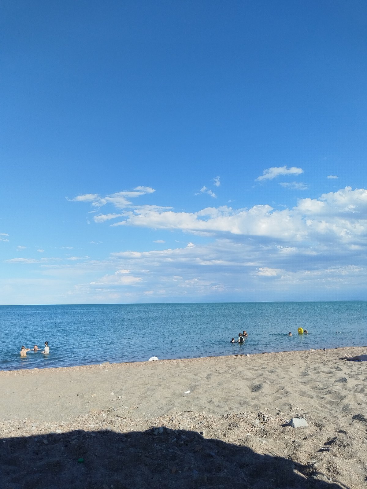 Calm beach day on the Kazakh shoreline near Qonaev