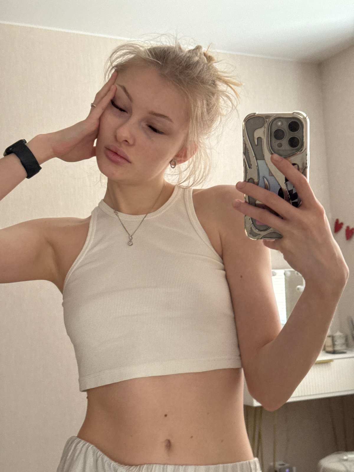Woman takes multiple selfies in Perm apartment settings
