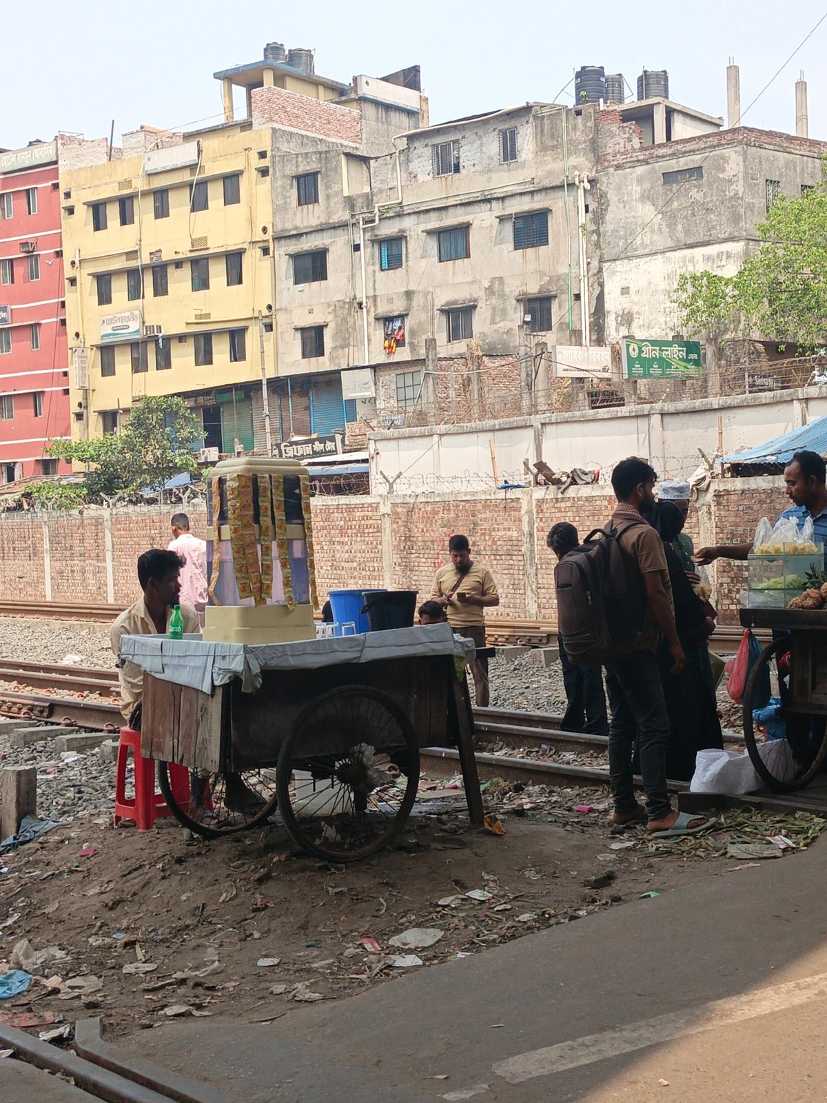 Morning street scene documented near Dhaka railway line