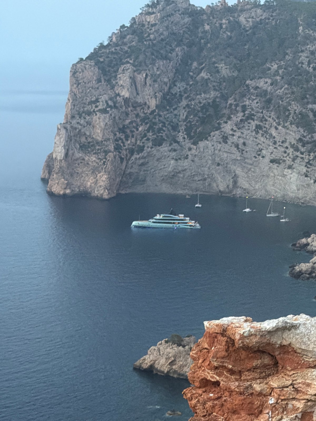 Clifftop sunset toasts on the Ibiza coastline