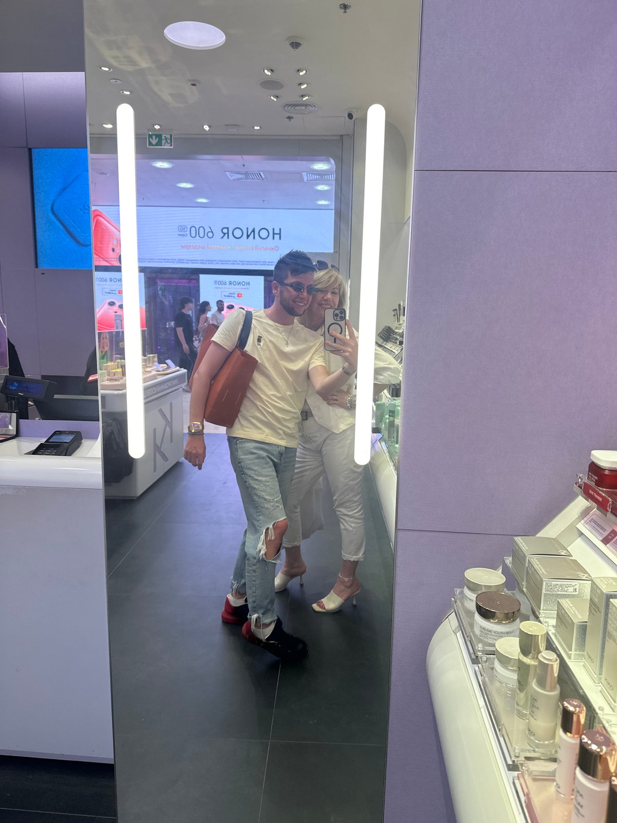 Couple enjoys casual shopping trip through Moscow retail stores