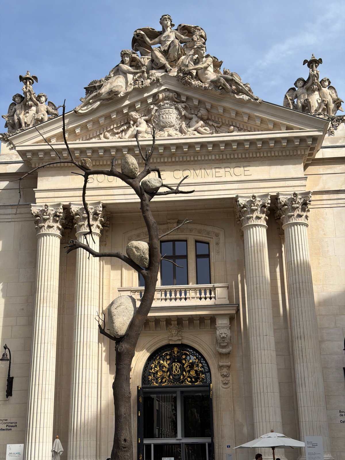 Reflective architecture and metallic flag observed in central Paris