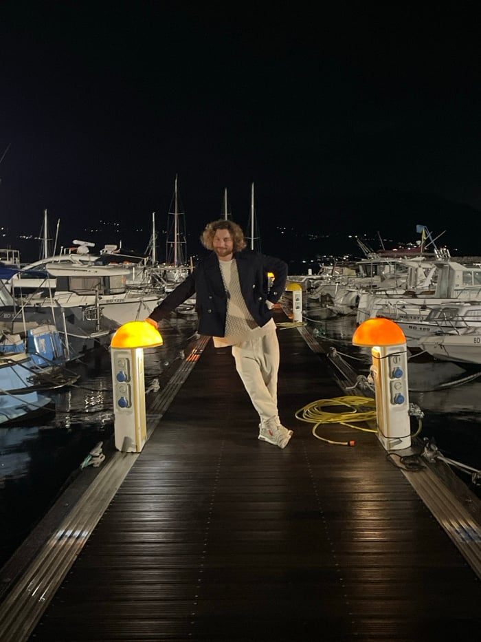 Late-night street musician performs acoustic set near Budva marina