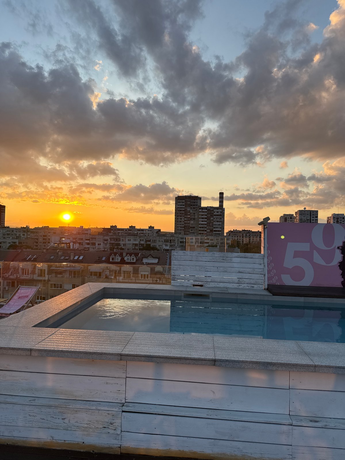 Sofia rooftop pool captures sunset panorama over Bulgarian capital