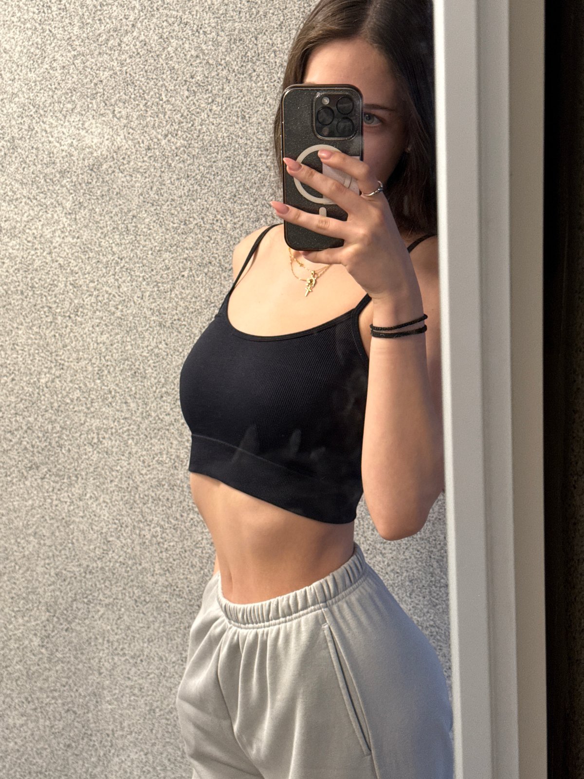 Woman takes mirror selfies indoors in Sofia, Bulgaria