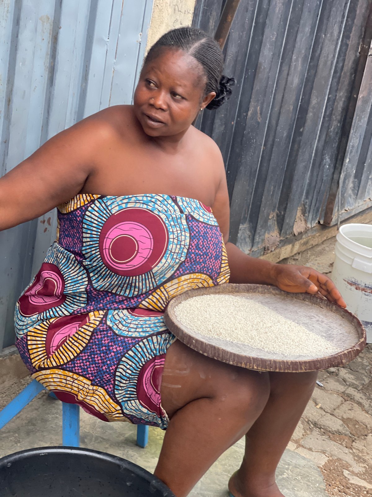 Women and children perform daily household tasks in Nyanya
