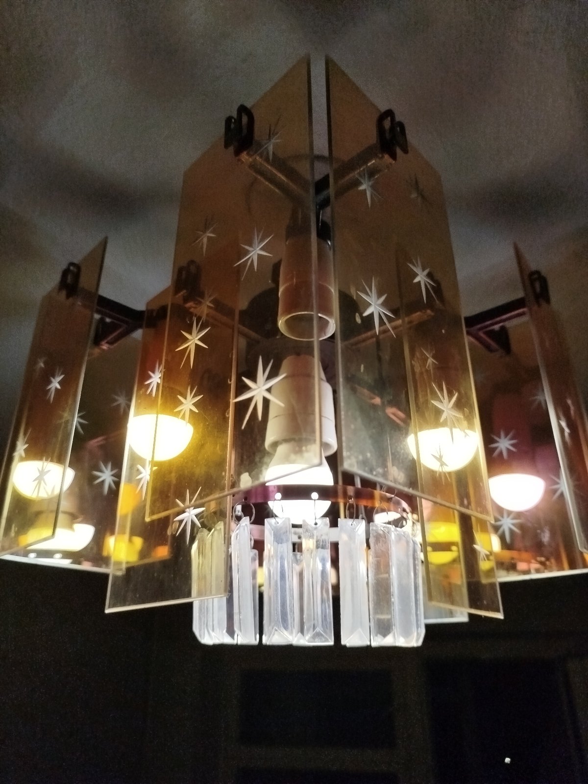 Close-up shots of four decorative ceiling light fixtures