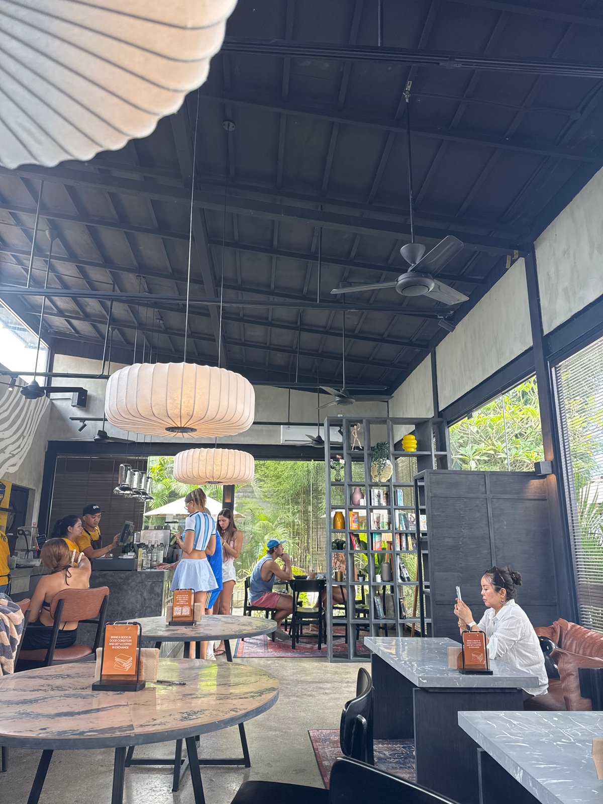 Pancakes and pendant lights at an industrial-style café