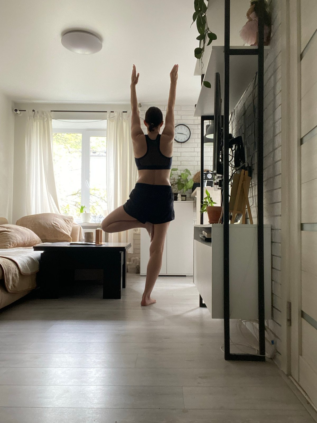 Woman practices early morning yoga in Chaikovsky, Russia