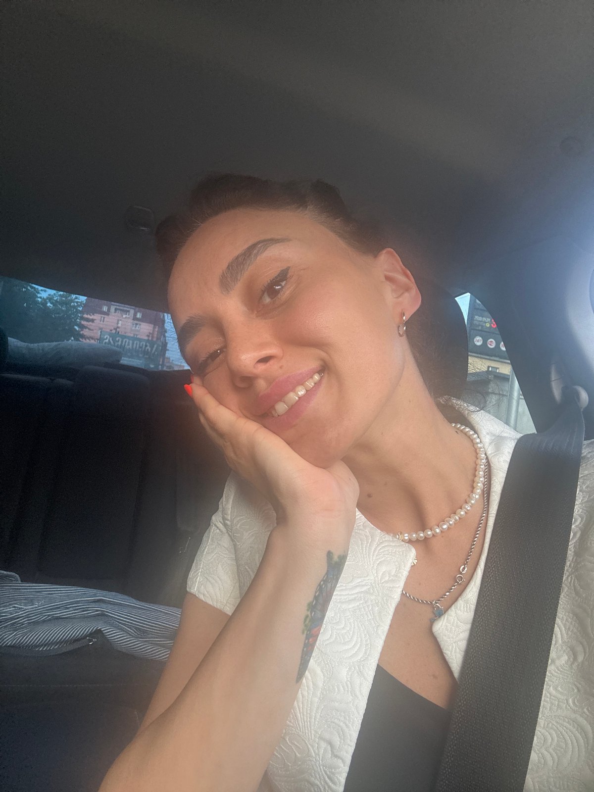 Woman documents afternoon drive through Tbilisi streets and landmarks