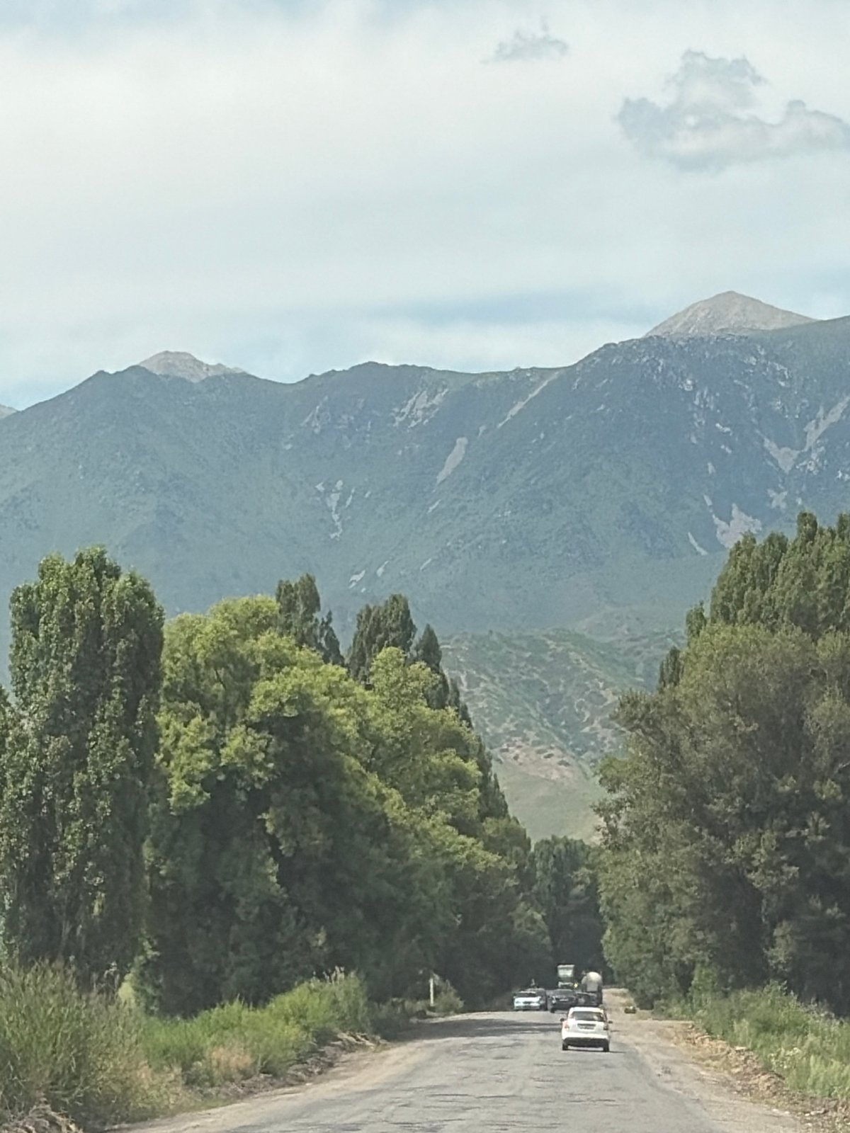 Road trip through mountain valleys with light traffic and scenic views