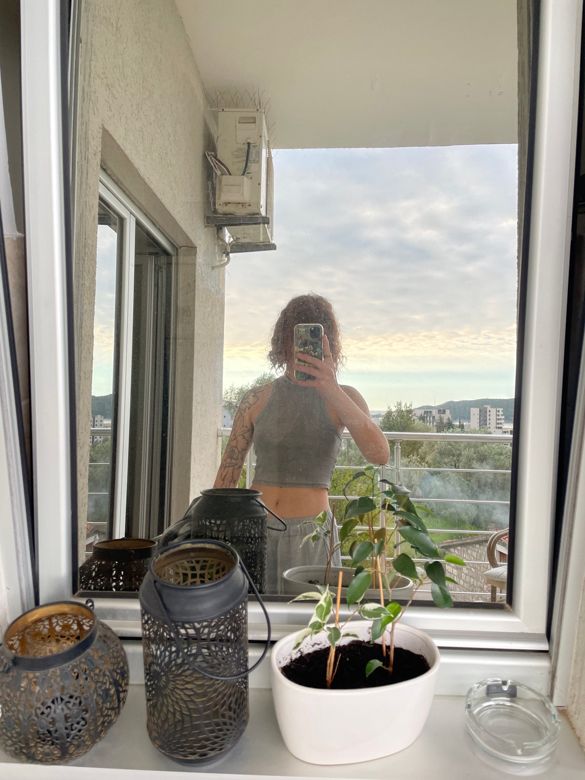 Tourist takes selfie on balcony in Rafailovići, Montenegro