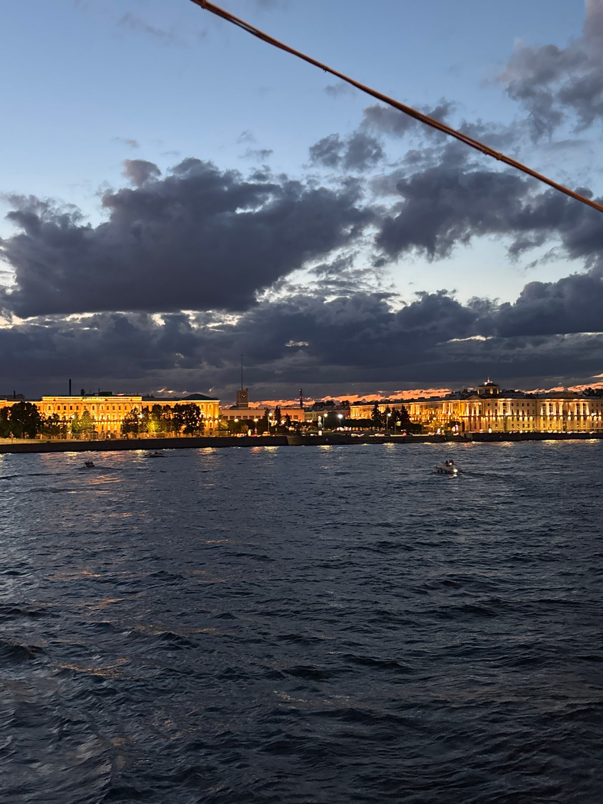 Saint Petersburg's drawbridges rise over the Neva at dusk
