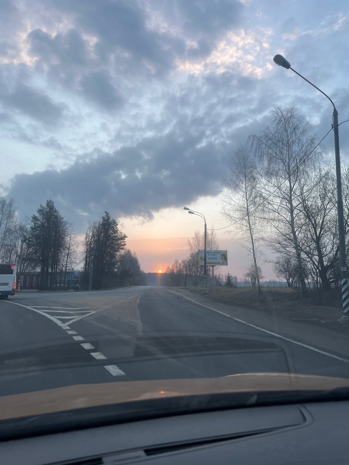 Sunset viewed from vehicle on Russian road