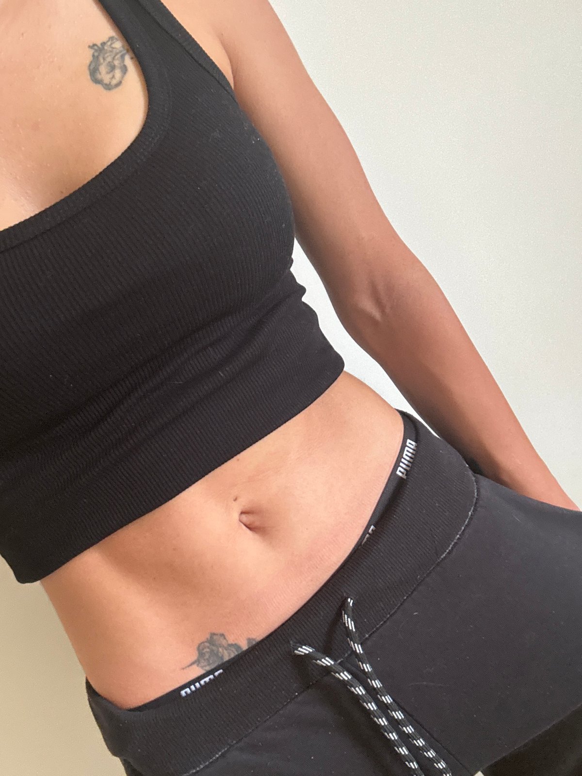 Person in black athletic wear captured in close-up view