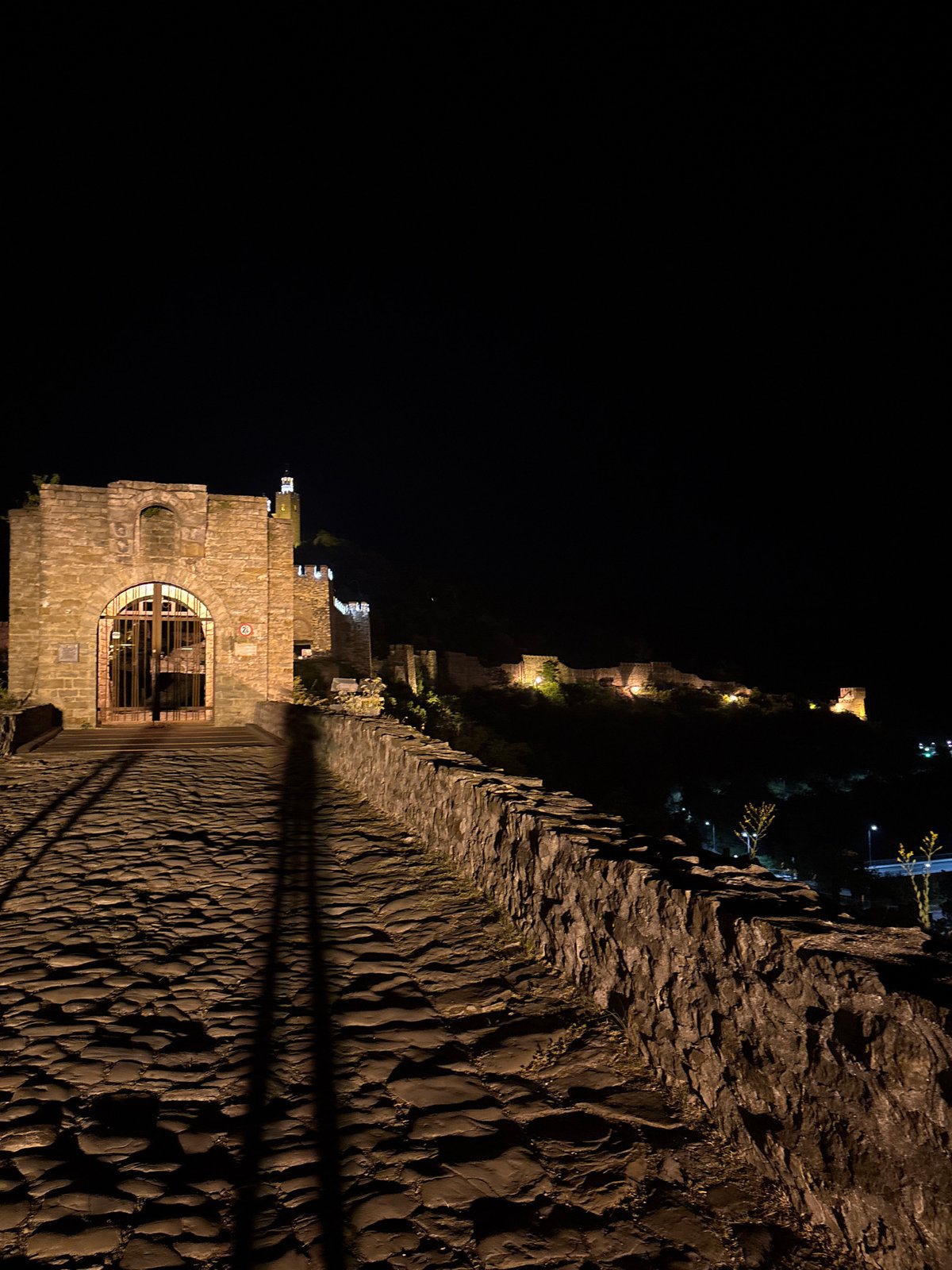 Tsarevets Fortress glowing at night over Veliko Tarnovo