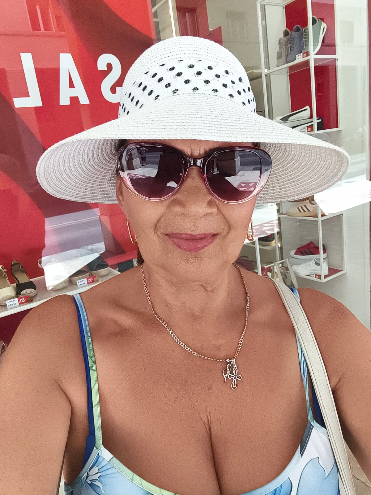 Polka dot hat and summer dress in Livorno