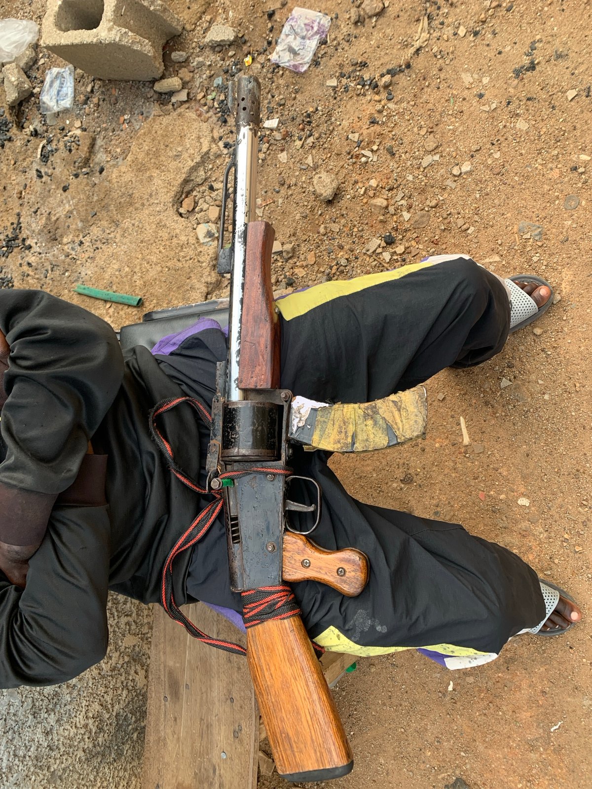 Nigerian stadium area witnesses report food vendors, weather, armed individuals