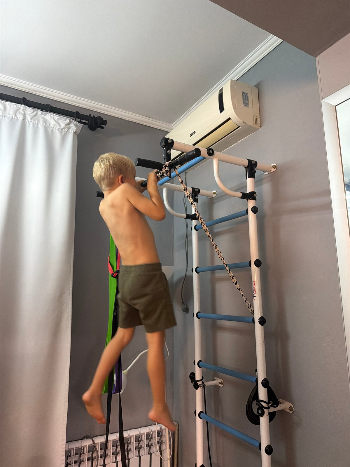 Family documents children's playtime and waffle-making in Sochi apartment