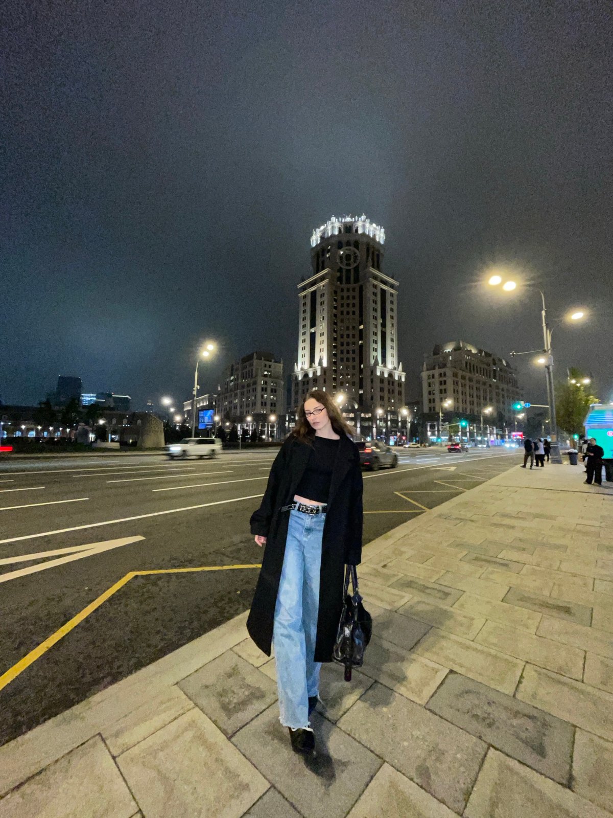 Person in black coat observed on Moscow sidewalk