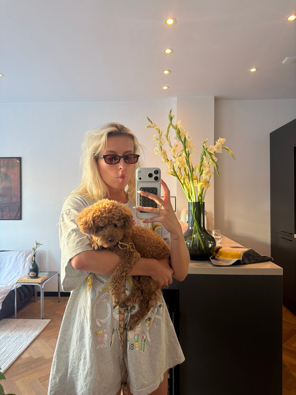 Mirror selfies with a poodle in an Amsterdam apartment