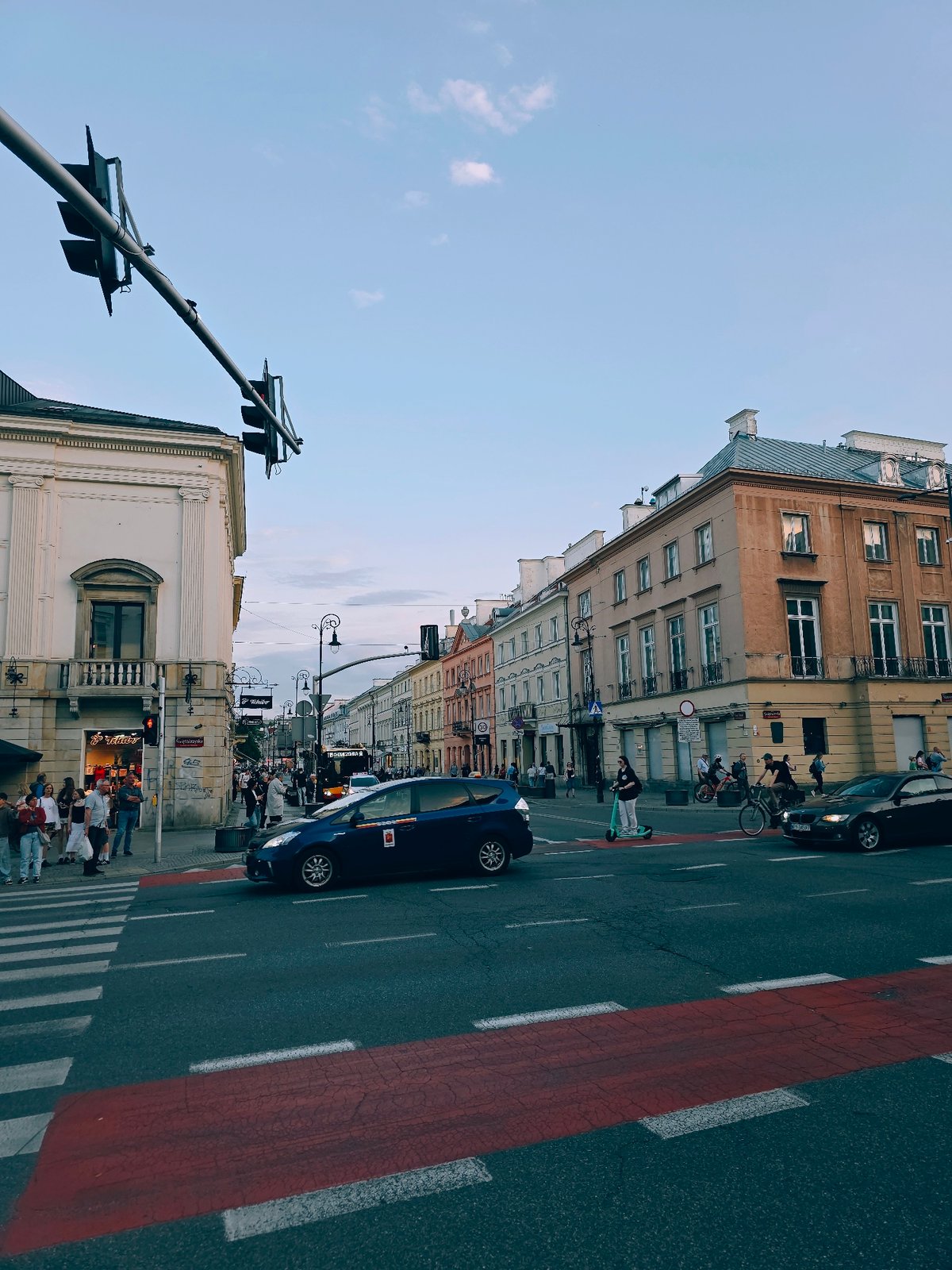 Evening street life documented across central Warsaw districts