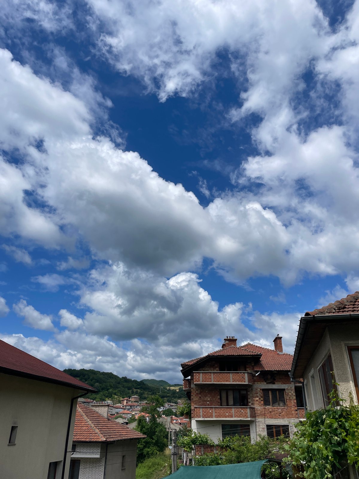 Morning views of Bulgarian mountain town documented under cloudy skies