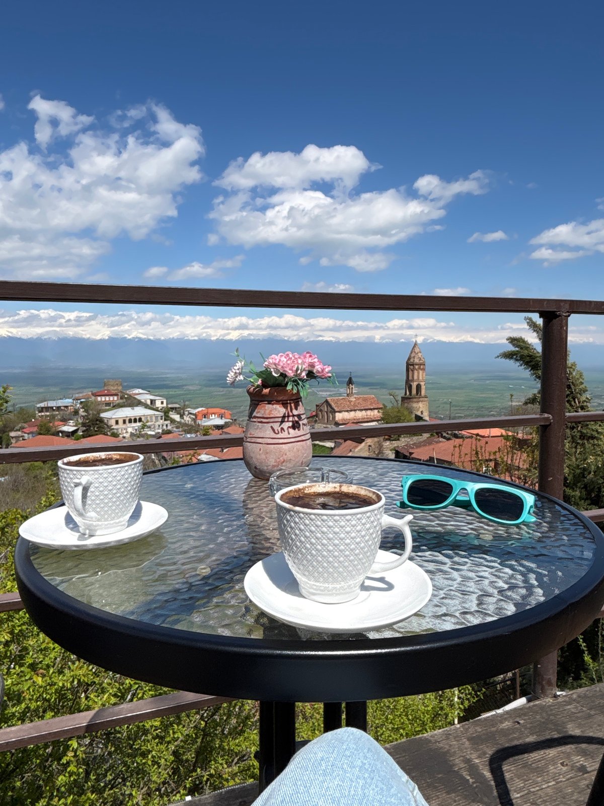 Morning coffee moment captured on Sighnaghi balcony overlooking Georgia