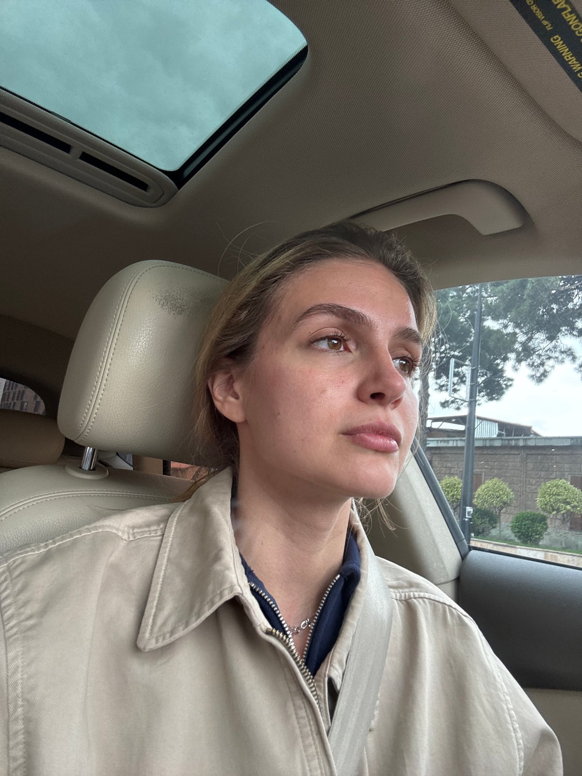 Woman resting in car captured in close-up moment