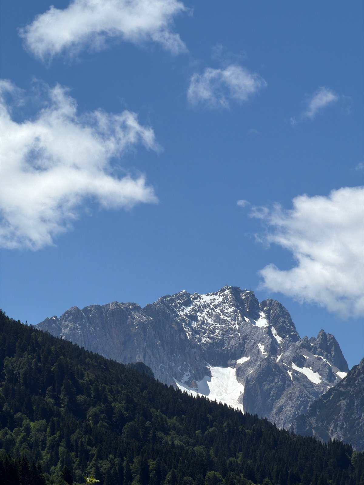 Tourist documents Alpine scenery and ski jump in Garmisch-Partenkirchen