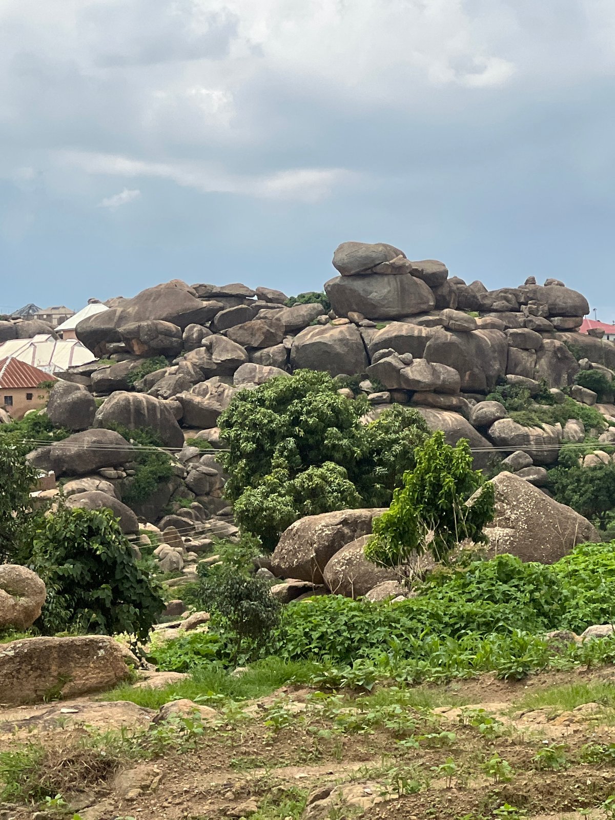 Exploring Jos's rocky hills, streams, and farmland on a quiet morning.