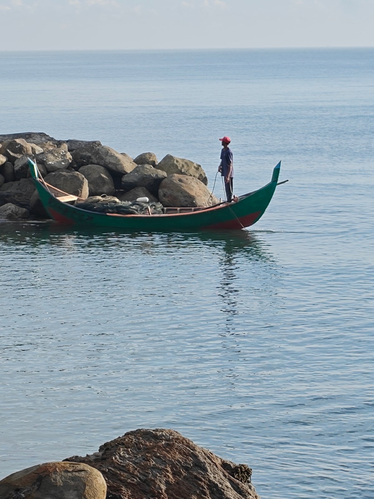 Morning fishing and wildlife observed on Lhokseumawe coastline