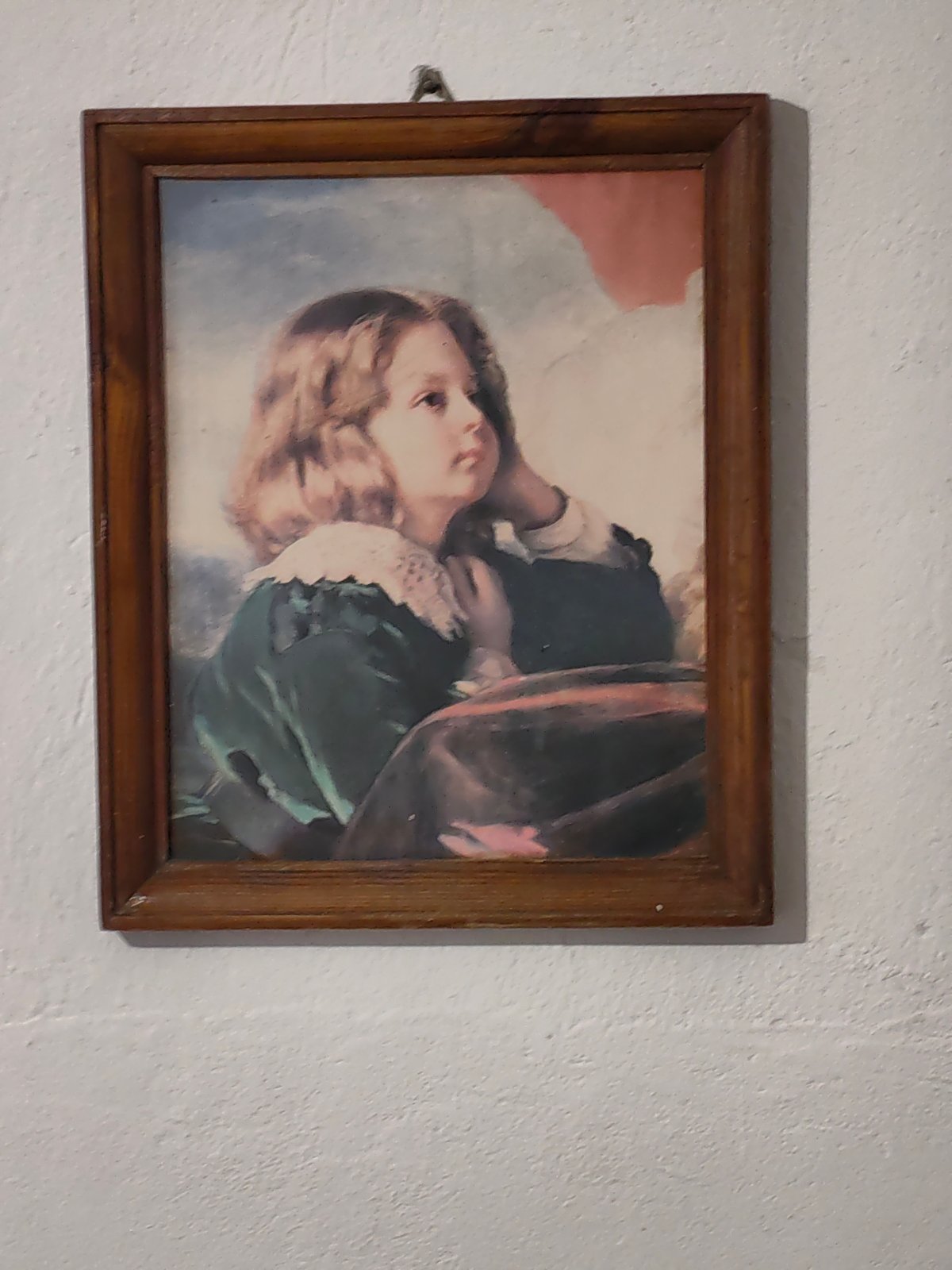 Local artworks depicting child portrait and village scene documented
