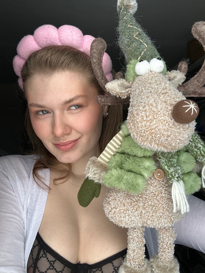 Russian woman's morning makeup routine captured with cat companion