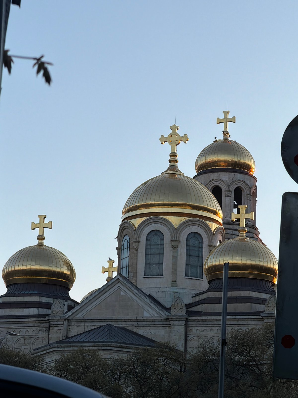 Golden-domed cathedral observed from Varna streets during afternoon