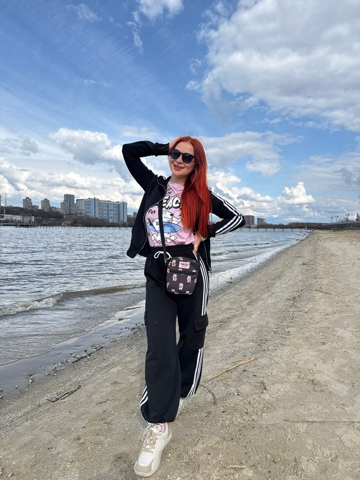 Woman poses for photos along Don River waterfront in Rostov-on-Don