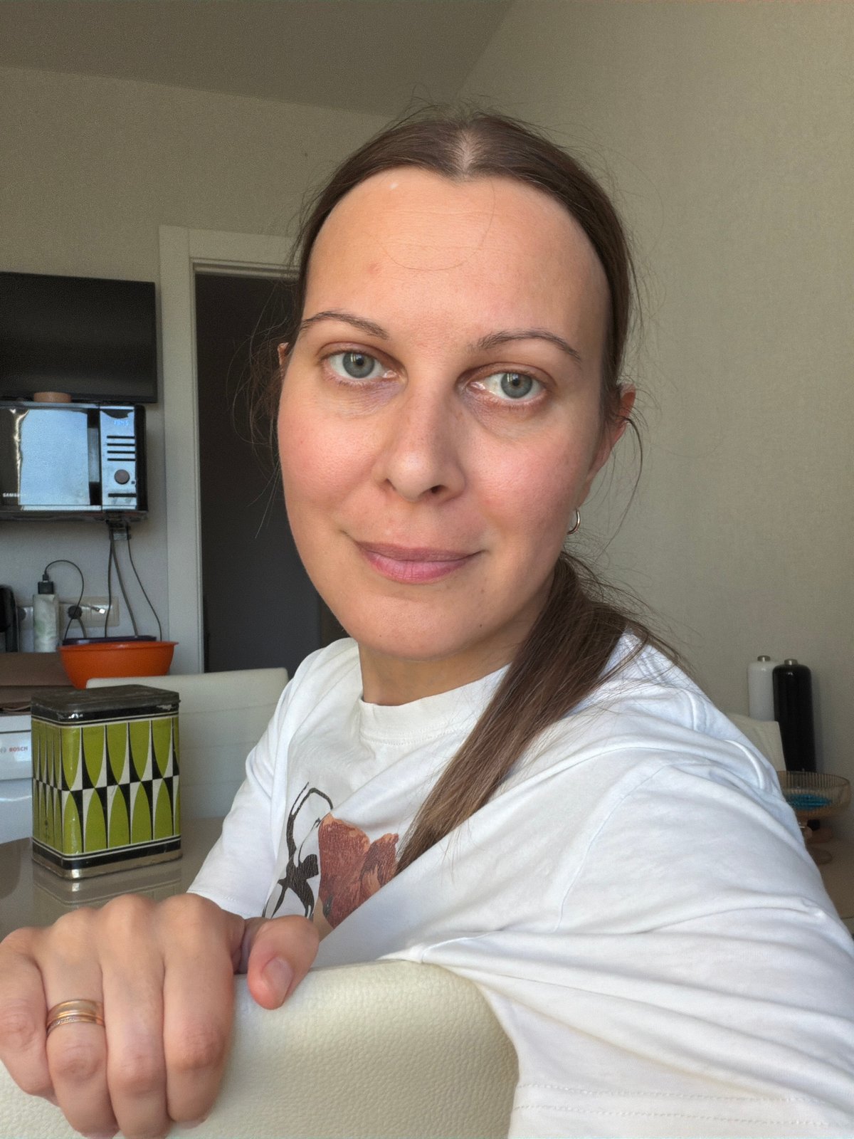 Woman and Sphynx cat captured in domestic scene in Izhevsk